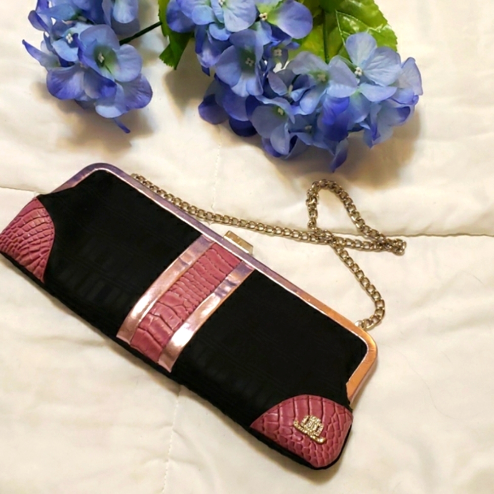 Clutch purse with chain strap.